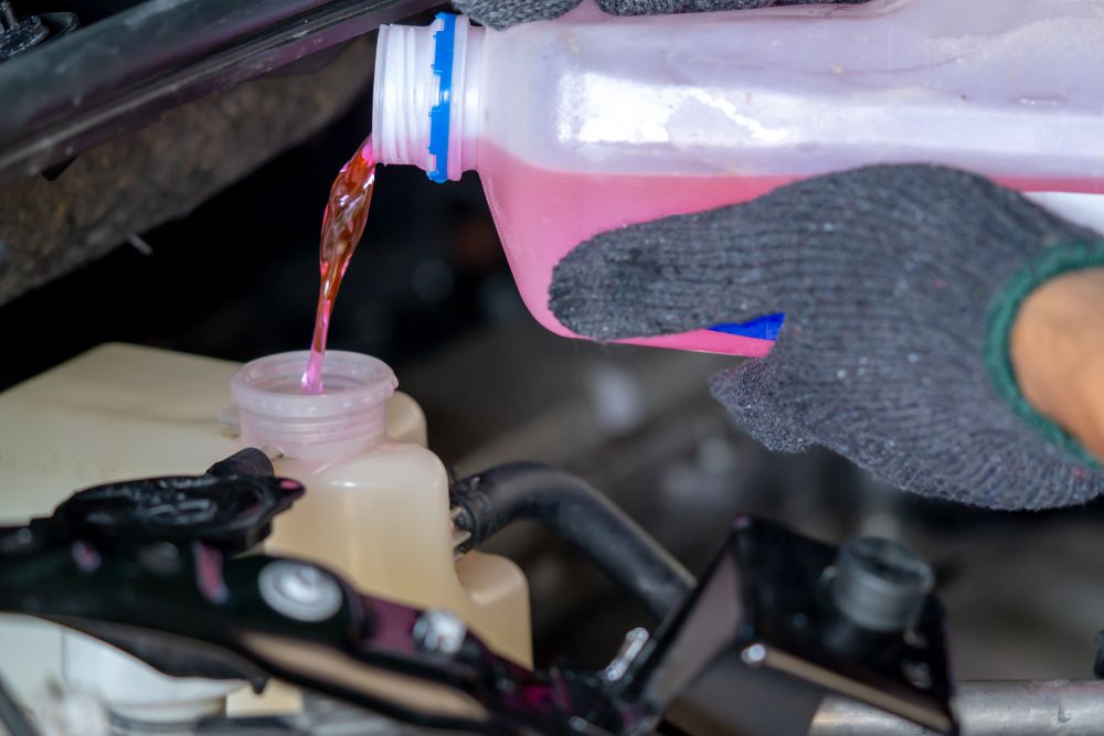 Adding coolant to a coolant reservoir