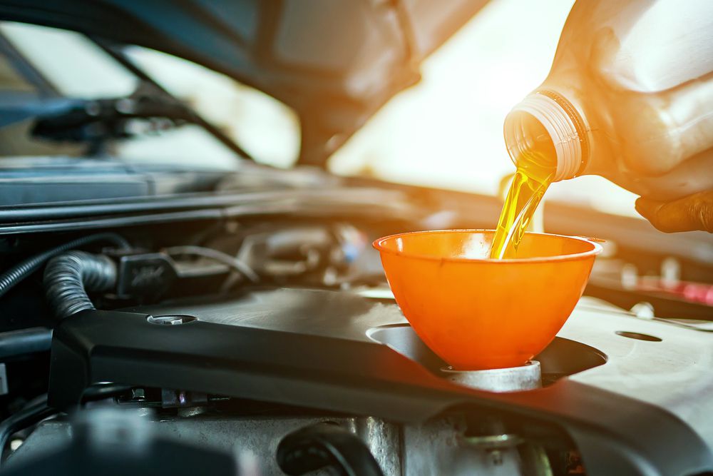 adding_engine_to_a_hot_engine_shutterstock_740139553