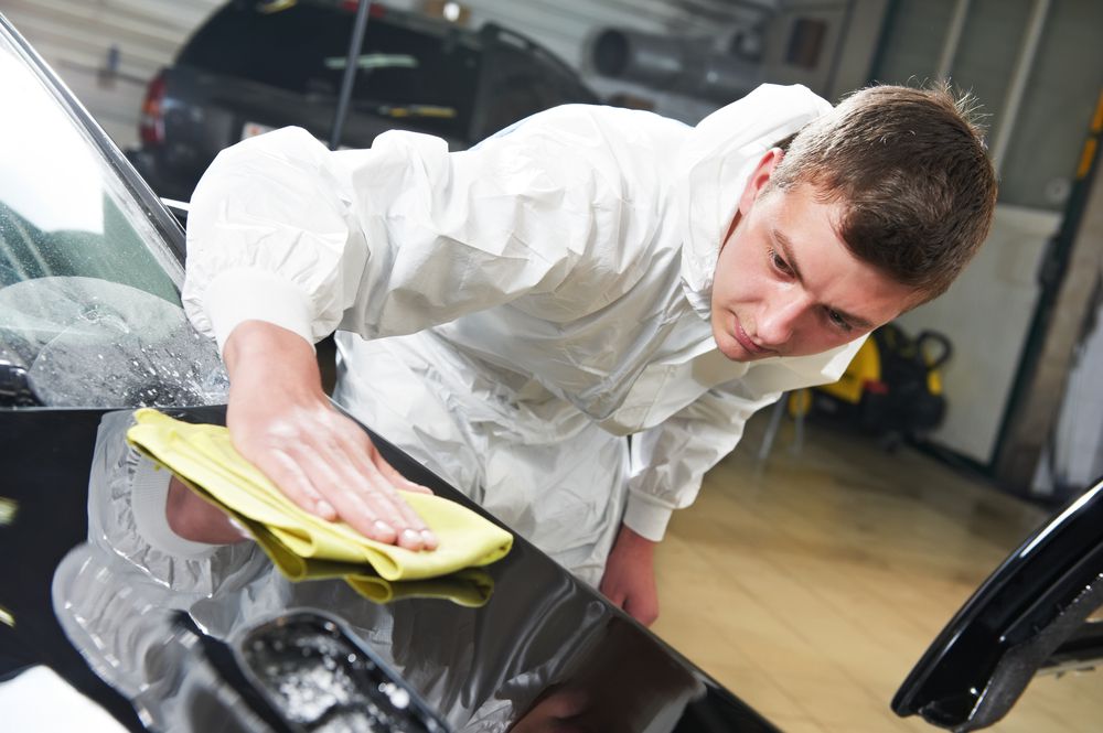 Applying wax by hand.