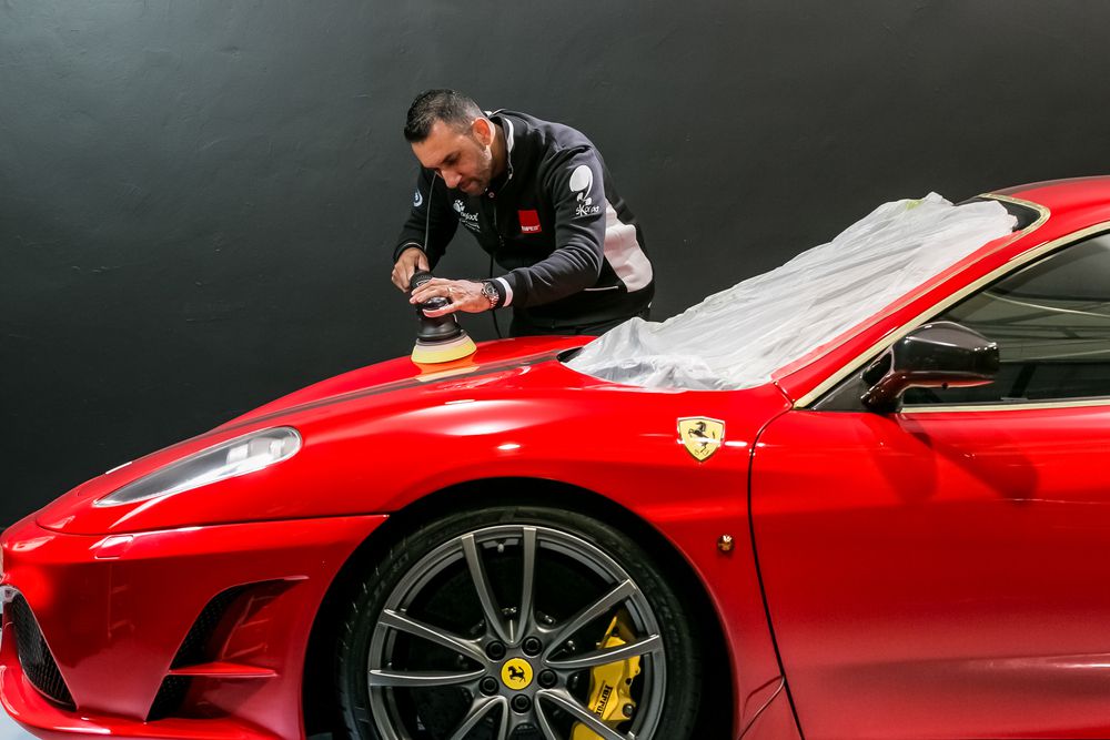 Applying wax by machine.