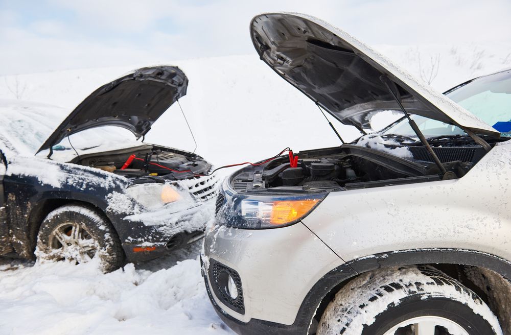 Boosting a battery with another vehicle