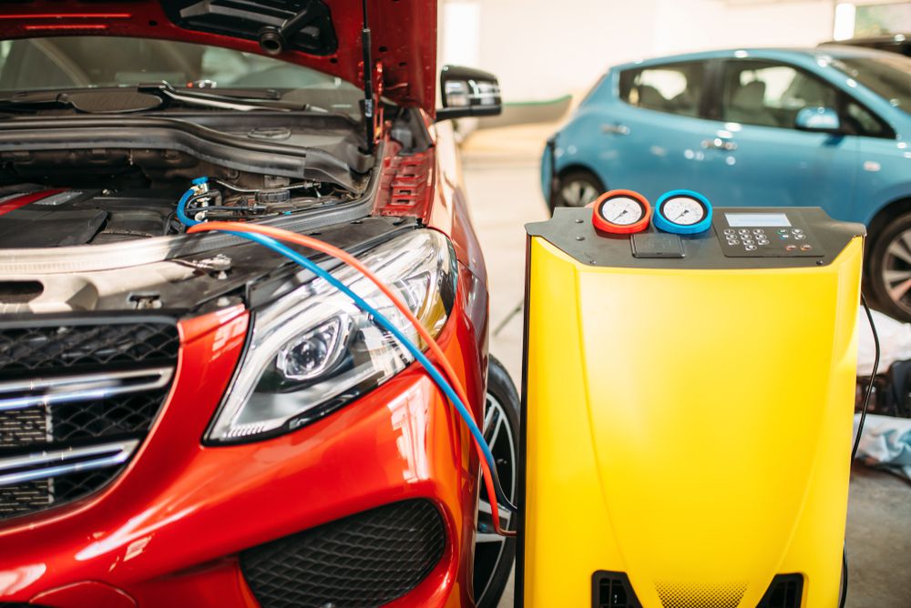 car_getting_ac_recharged_at_auto_repair_shop_shutterstock_1213880767