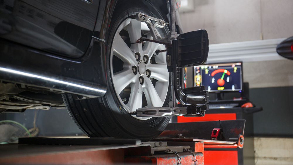 Car on wheel alignment machine