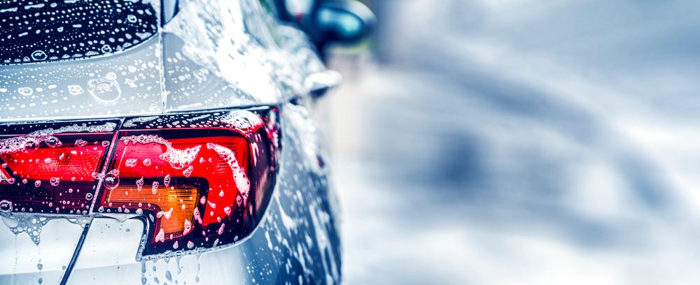 Car soap bubbles on the surface of a car.