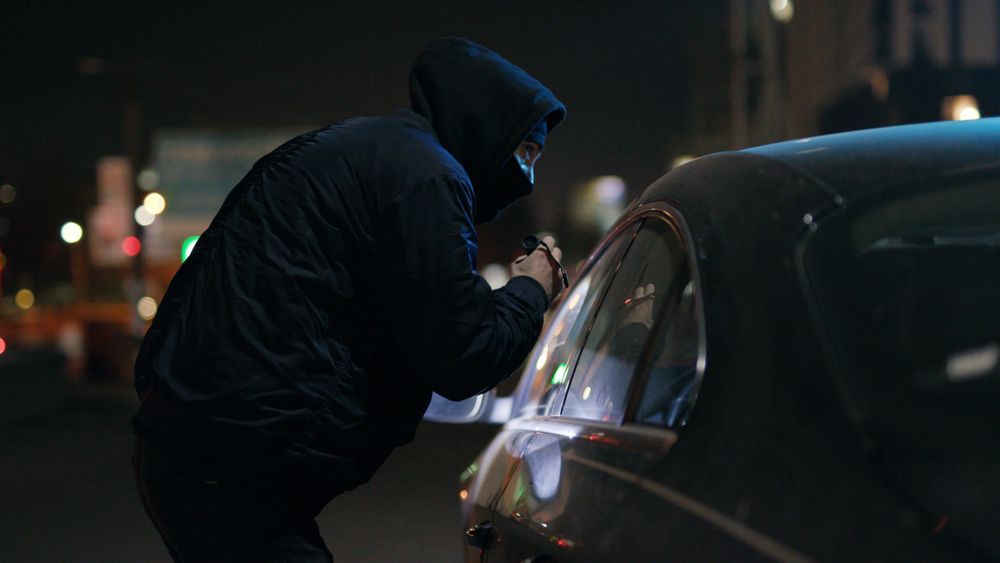 Car thief scoping out a car