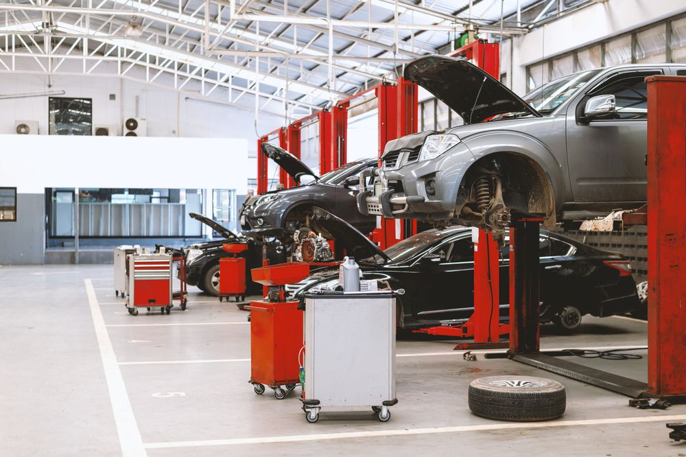 Cars being worked on in the shop