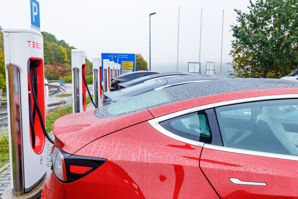 charging_a_tesla_in_the_rain_shutterstock_1532874026