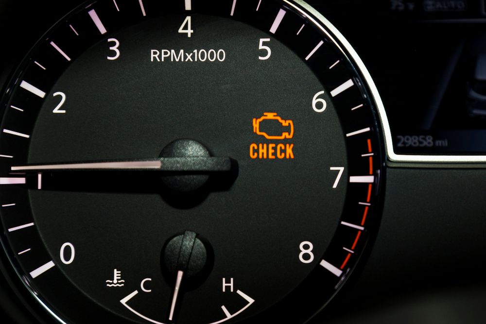 Check engine light on car dashboard.