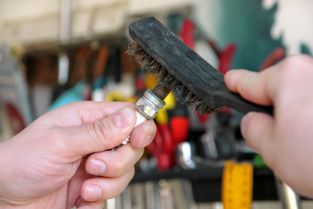 Sparkplugs can be cleaned if they just have a light carbon coating.