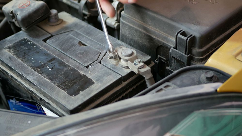 Disconnecting the negative battery cable while the car is running.