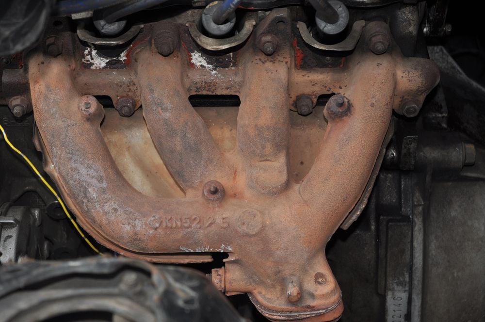 Exhaust manifold on an older engine.