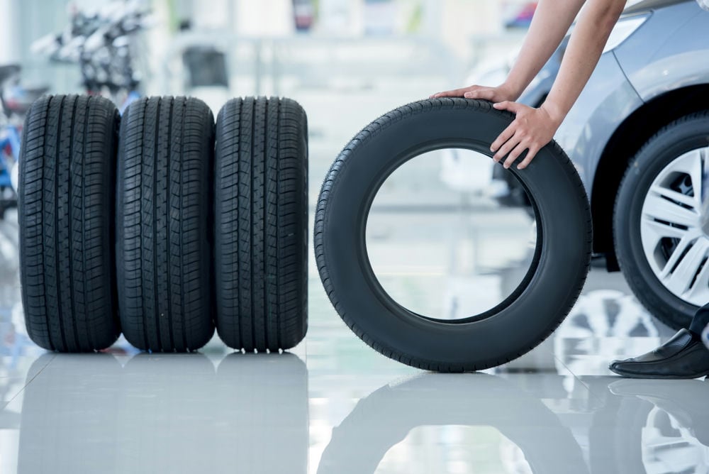 New factory tires at the car dealership.