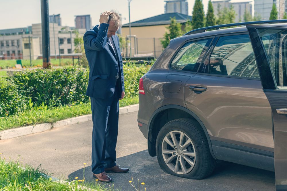 A flat tire due to a popped tire.