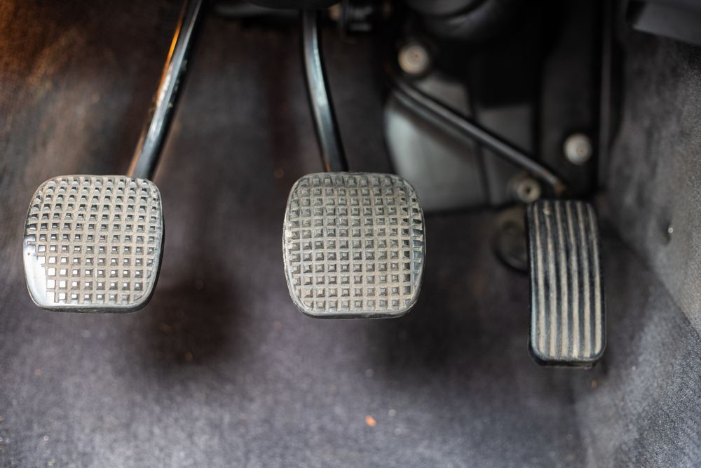 Left to right: clutch, brake and gas pedals.