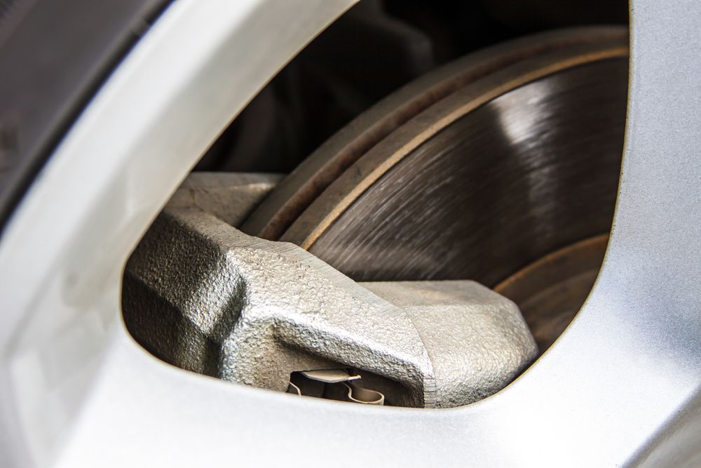 You can inspect a brake rotor throug the wheel on many vehicles.