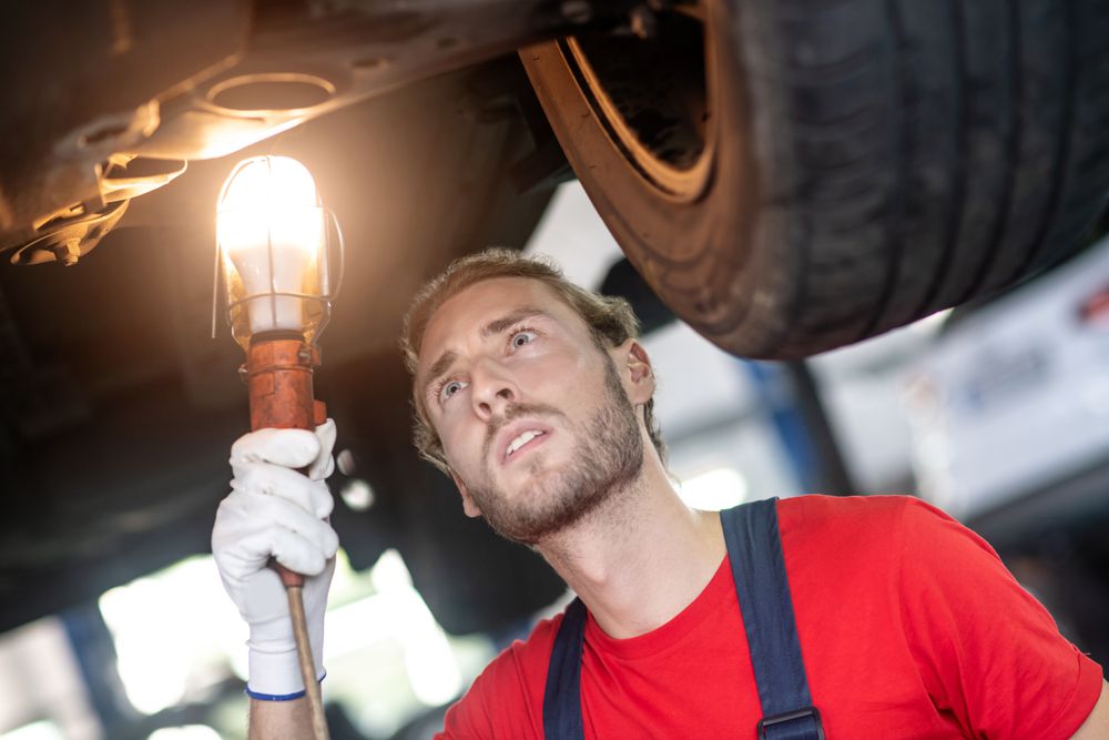 Mechanic performing a pre-purchase inspection