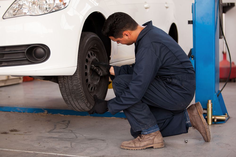 mechanic_rotating_tires_shutterstock_143187724