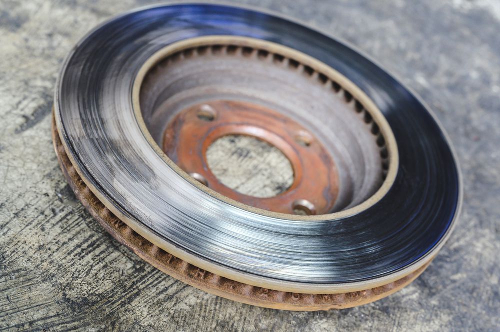 Old warped brake rotors can cause shaking in the car steering wheel.