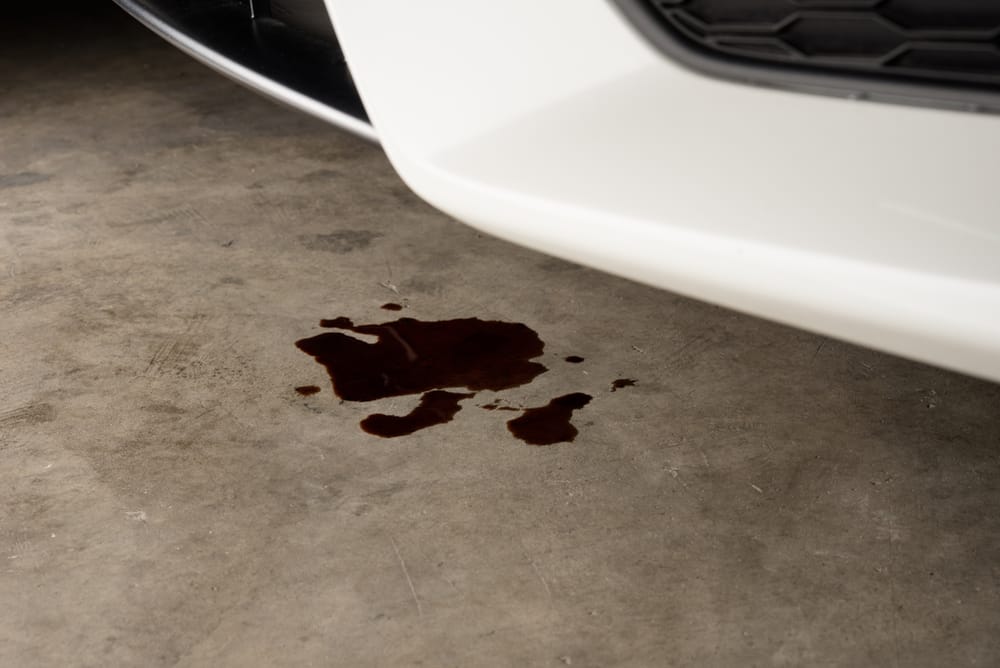 A power steering leak on the garage floor.