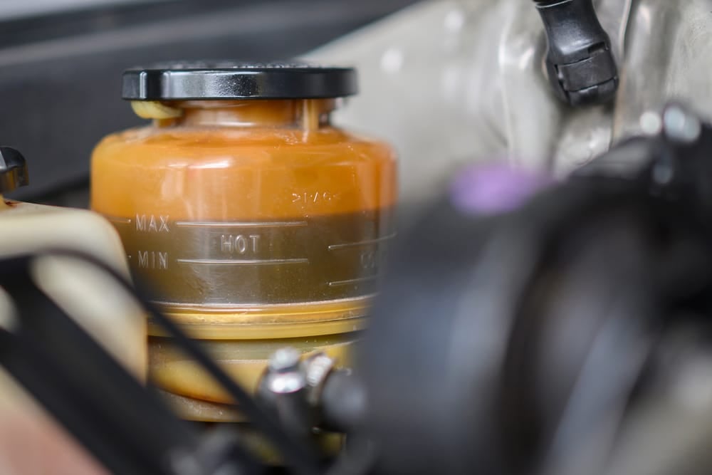 The power steering reservoir has min and max levels to denote the proper fluid level.