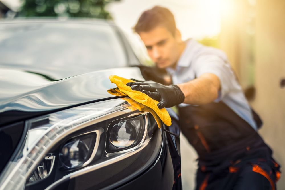 Removing car wax with vinegar.