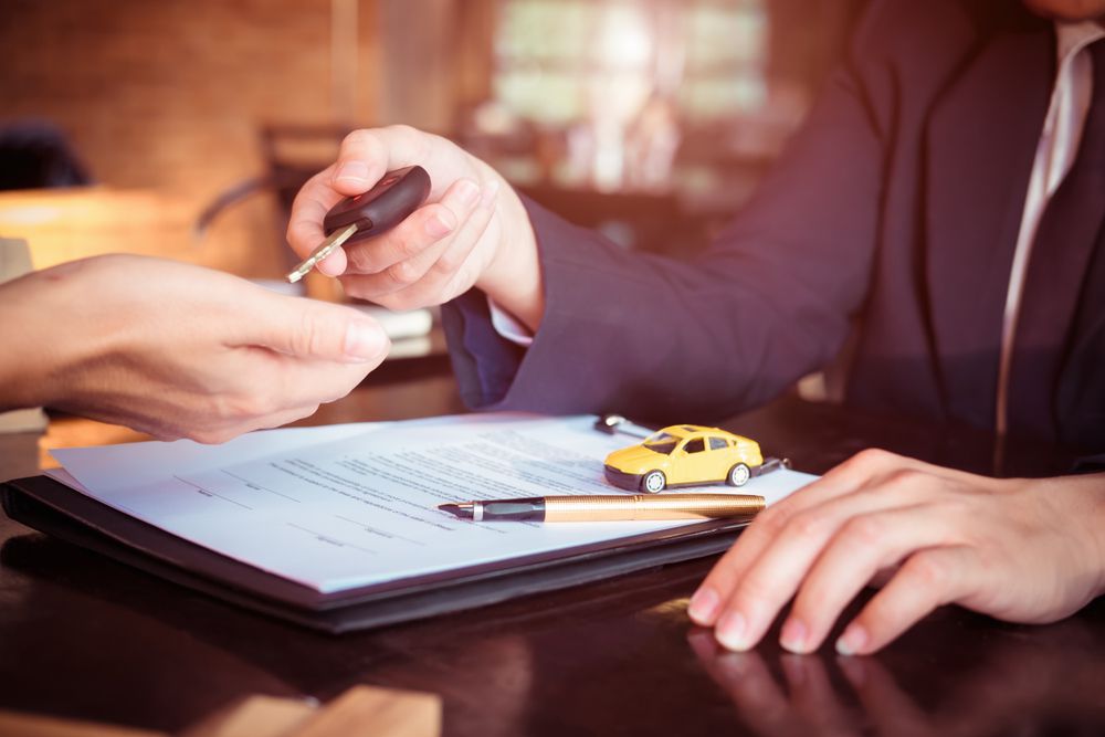 Signing a car warranty.