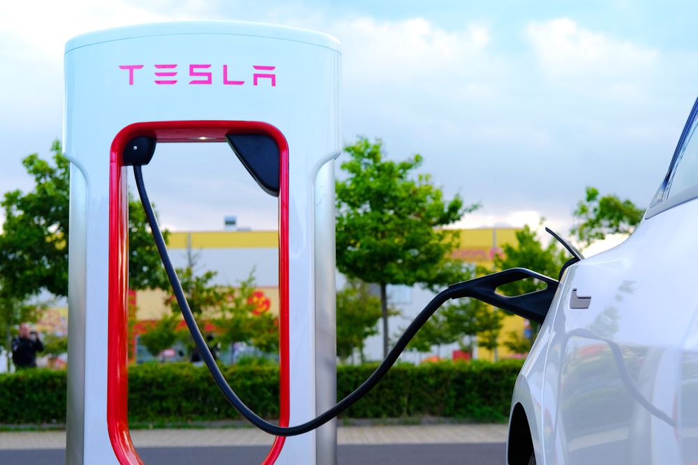 Tesla at a charging station