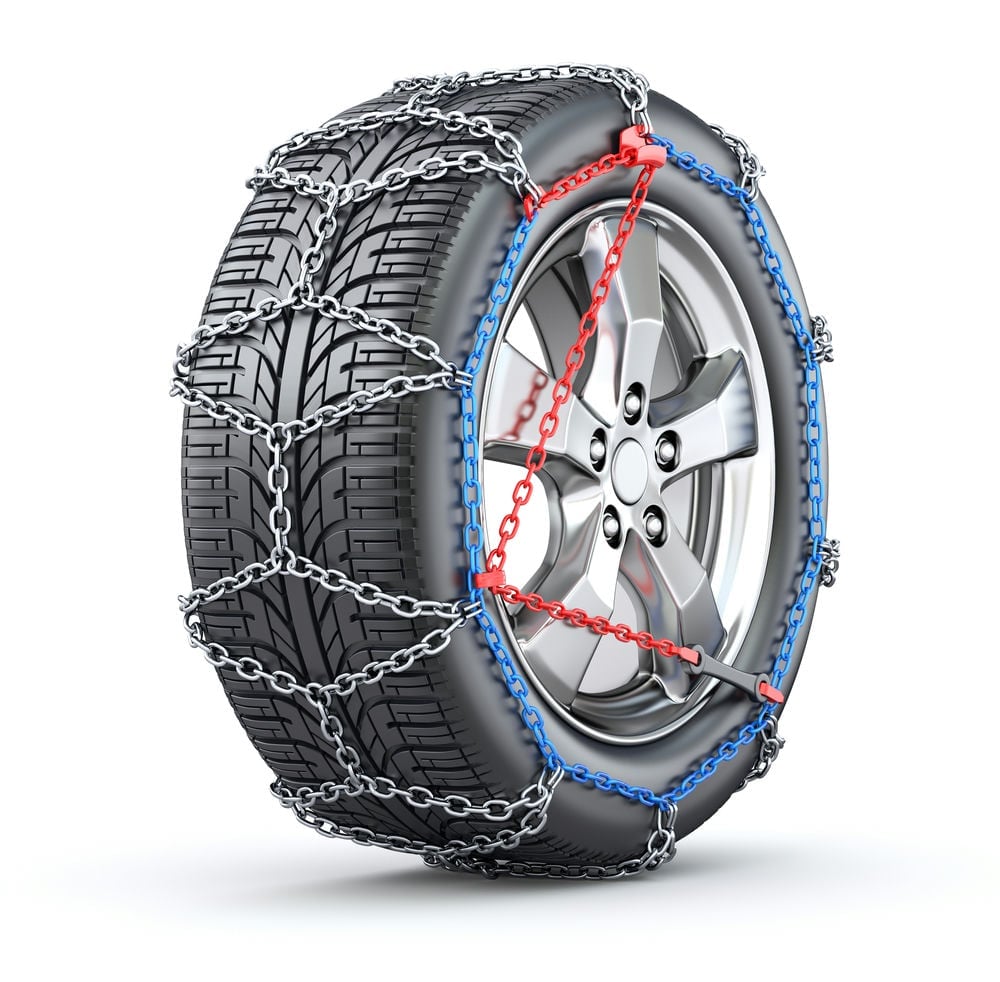 A tire chain properly installed on a tire.
