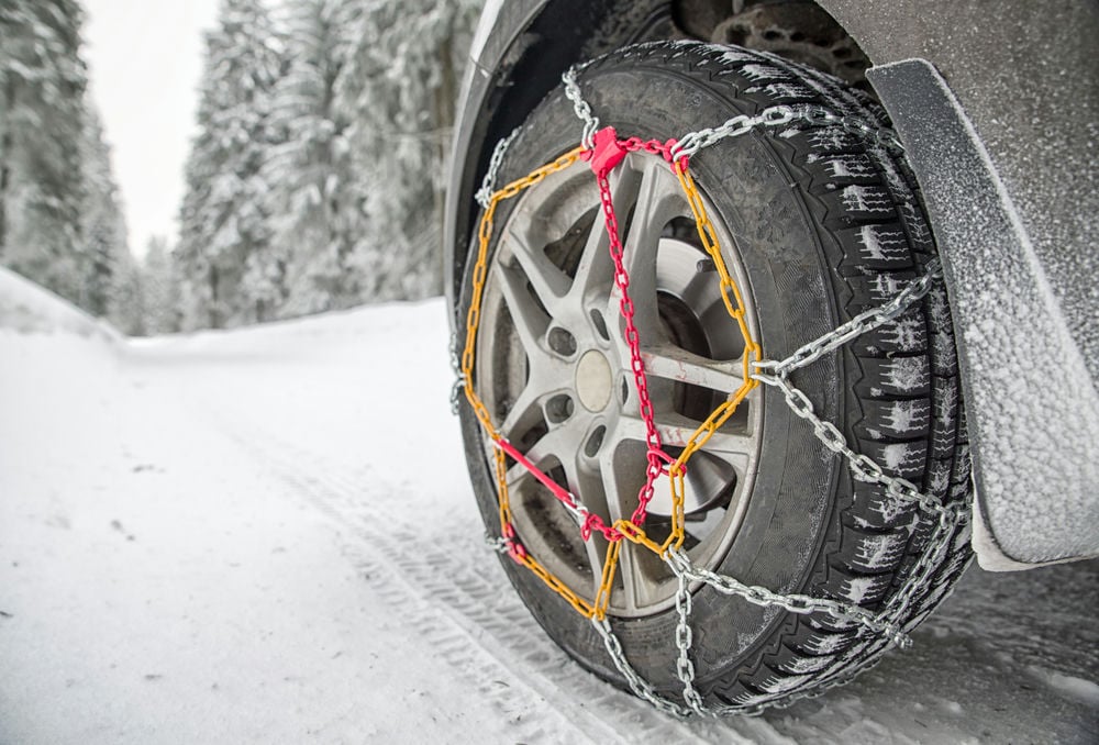 Tire chains are recommended for extreme conditions like unmaintained forest or mountain roads.