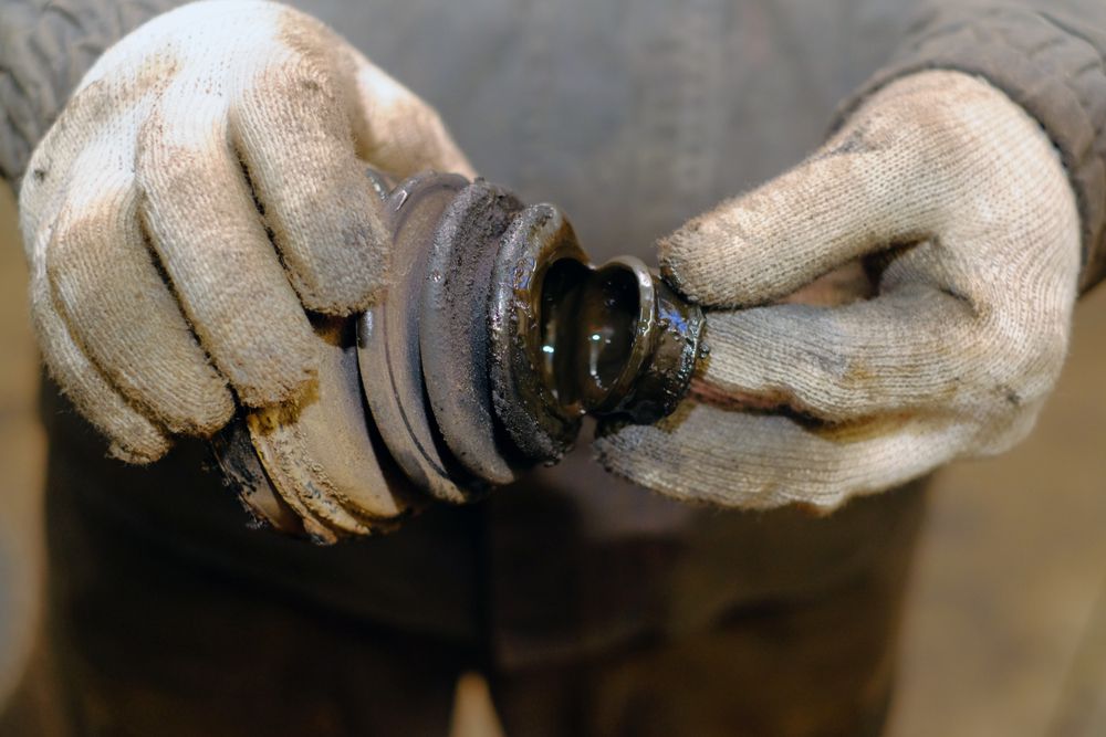 Torn CV joint boot.