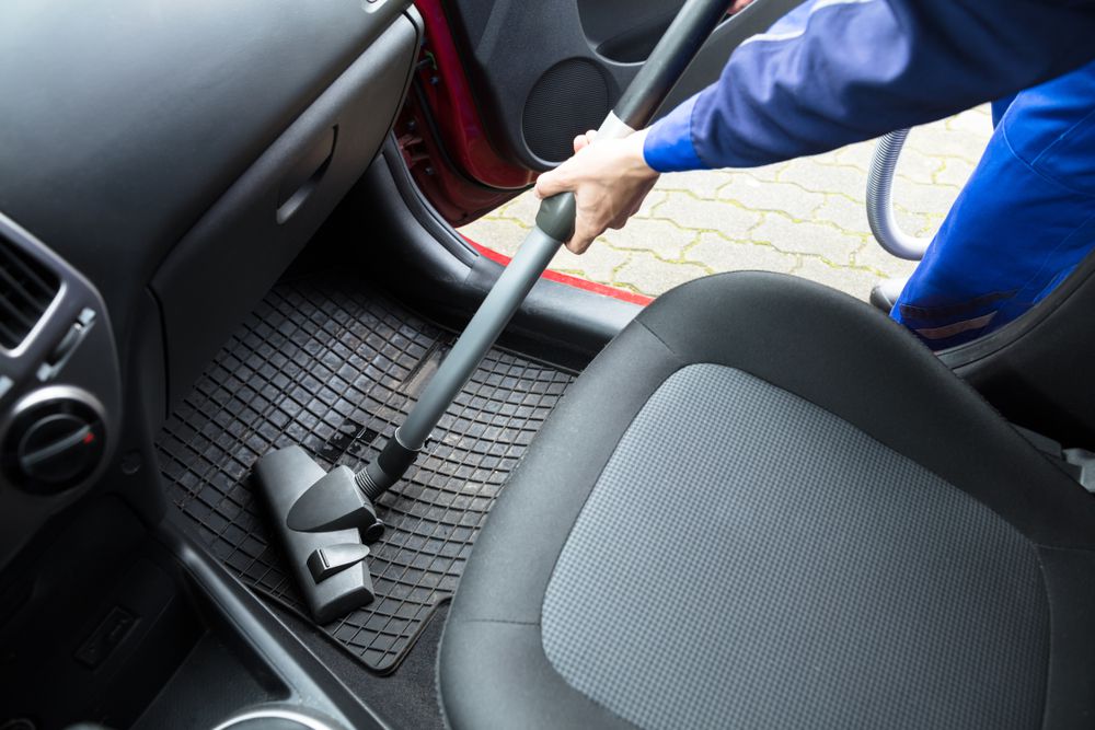 Vacuuming rubber car mat