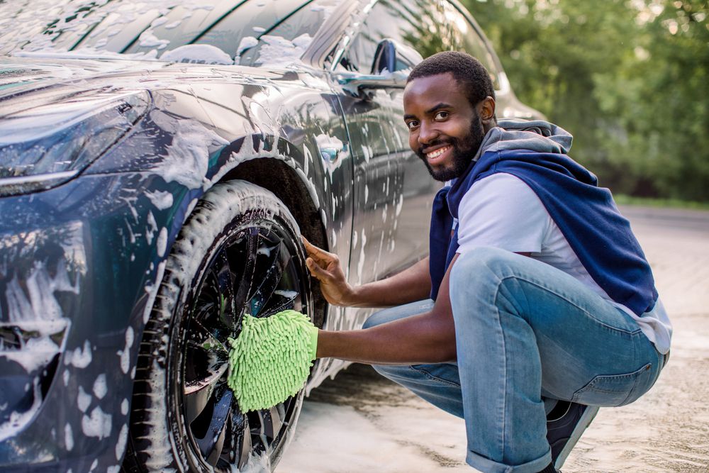 Washing a car with microfiber wash mitts