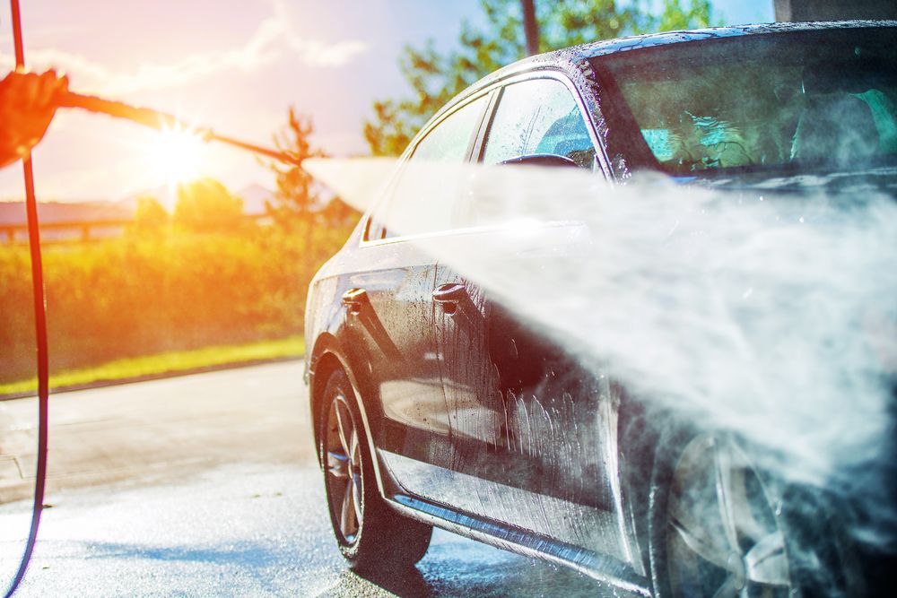 Washing a car with only water.